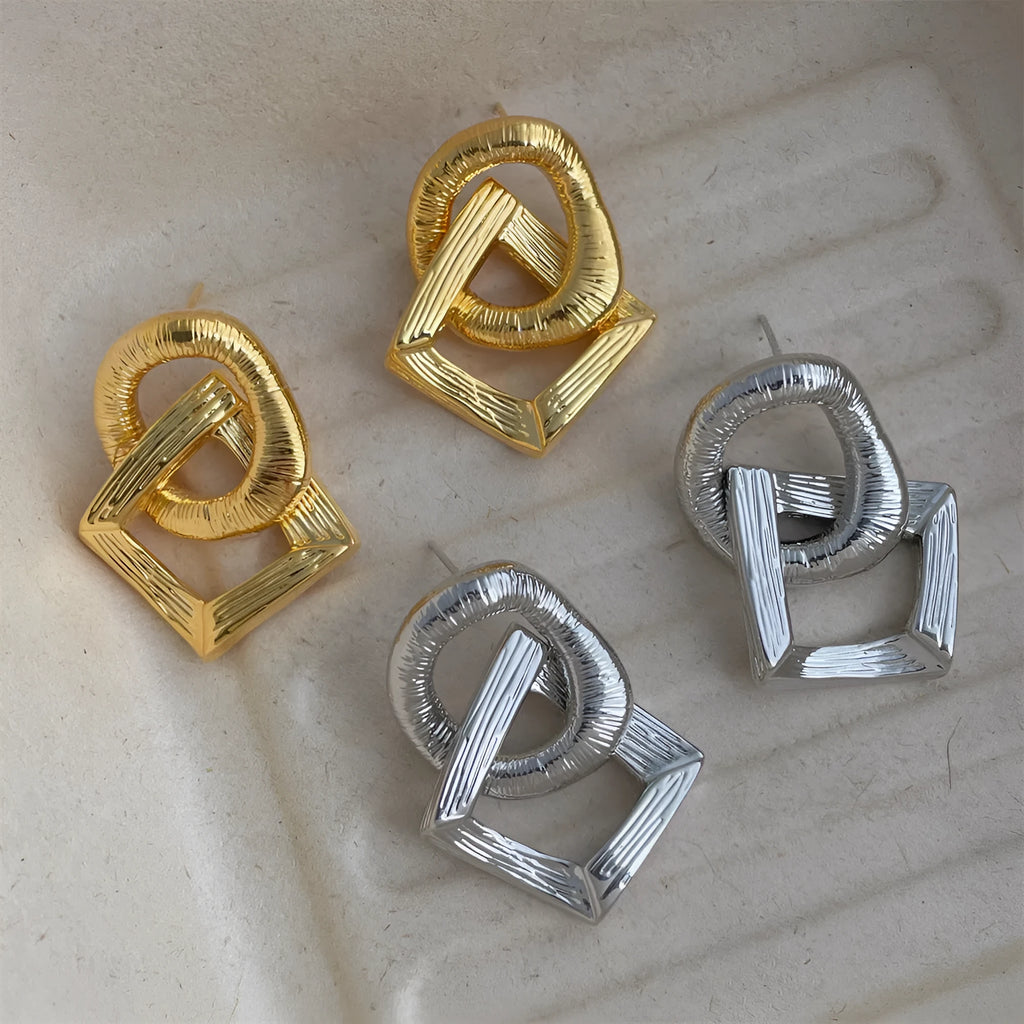 Retro geometric circle pendant earrings in gold or silver, made from copper with a 3.4cm drop.