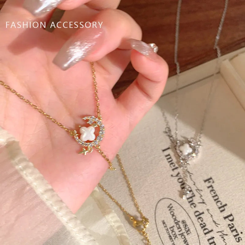 Gold star moon zirconium necklace on adjustable copper chain with celestial pendant design