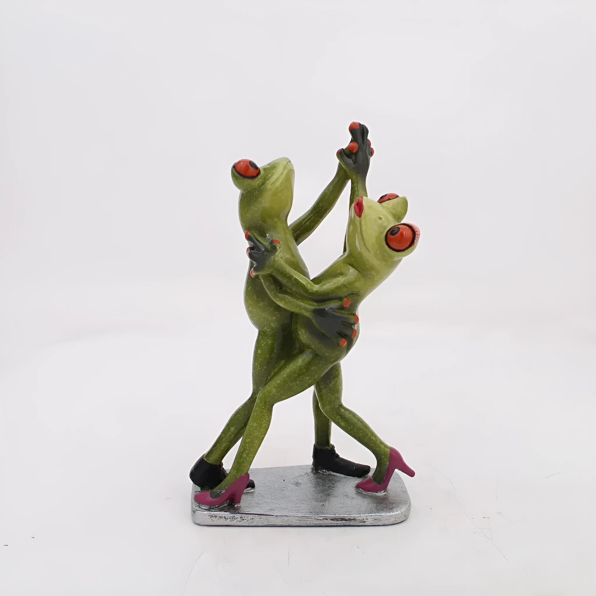Pastoral style synthetic resin frog ornament for home decoration on a wooden shelf.