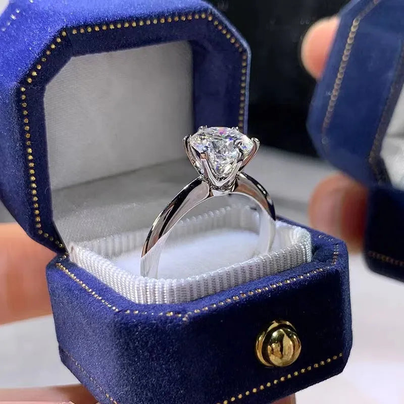 White gold plated geometric ring with a six-claw setting holding a zircon stone