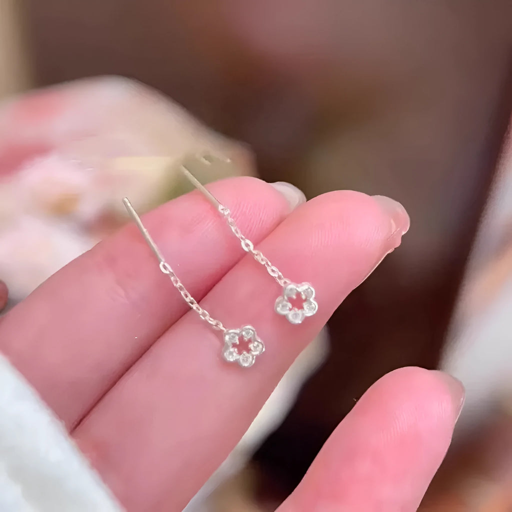 Sterling silver hollow flower dangling earrings with natural petal design and butterfly backs