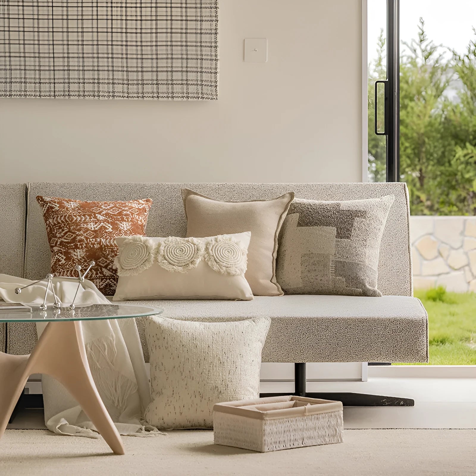 A square coreless decorative sofa cushion with an abstract geometric pattern in red and brown colours.