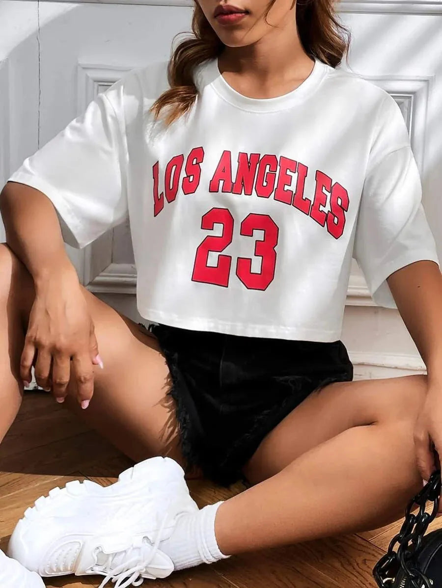 Women's personalised black cotton T-shirt with white English letters, loose fit and exposed navel design.