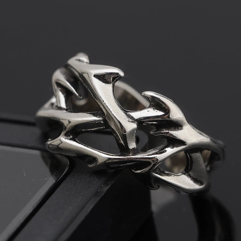 Adjustable copper men's ring with geometric thorn and flower design.