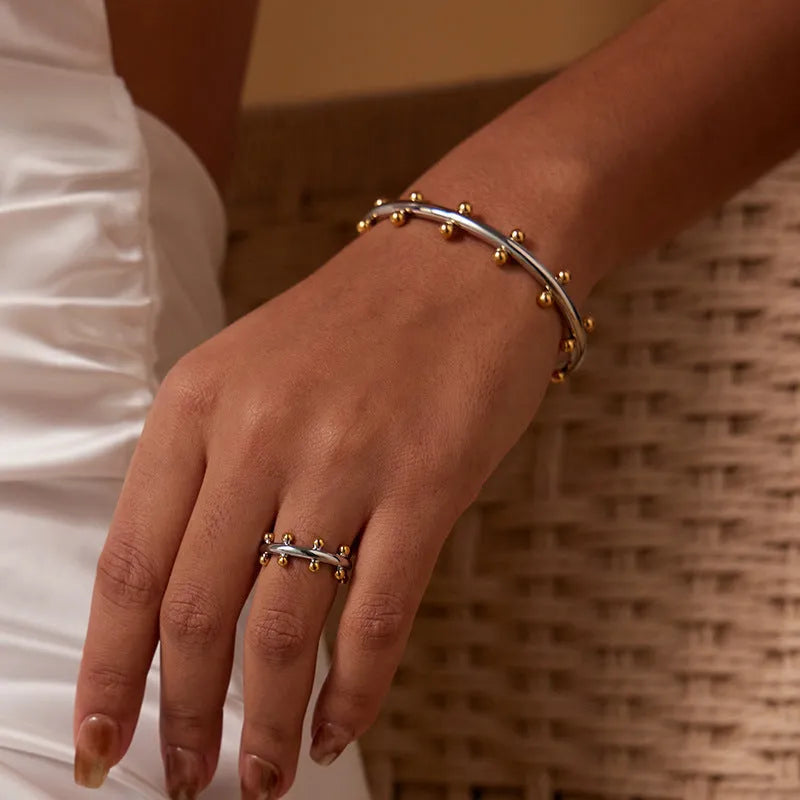 Stainless steel C-shaped texture beads with rivet design in gold, steel, and steel gold finishes