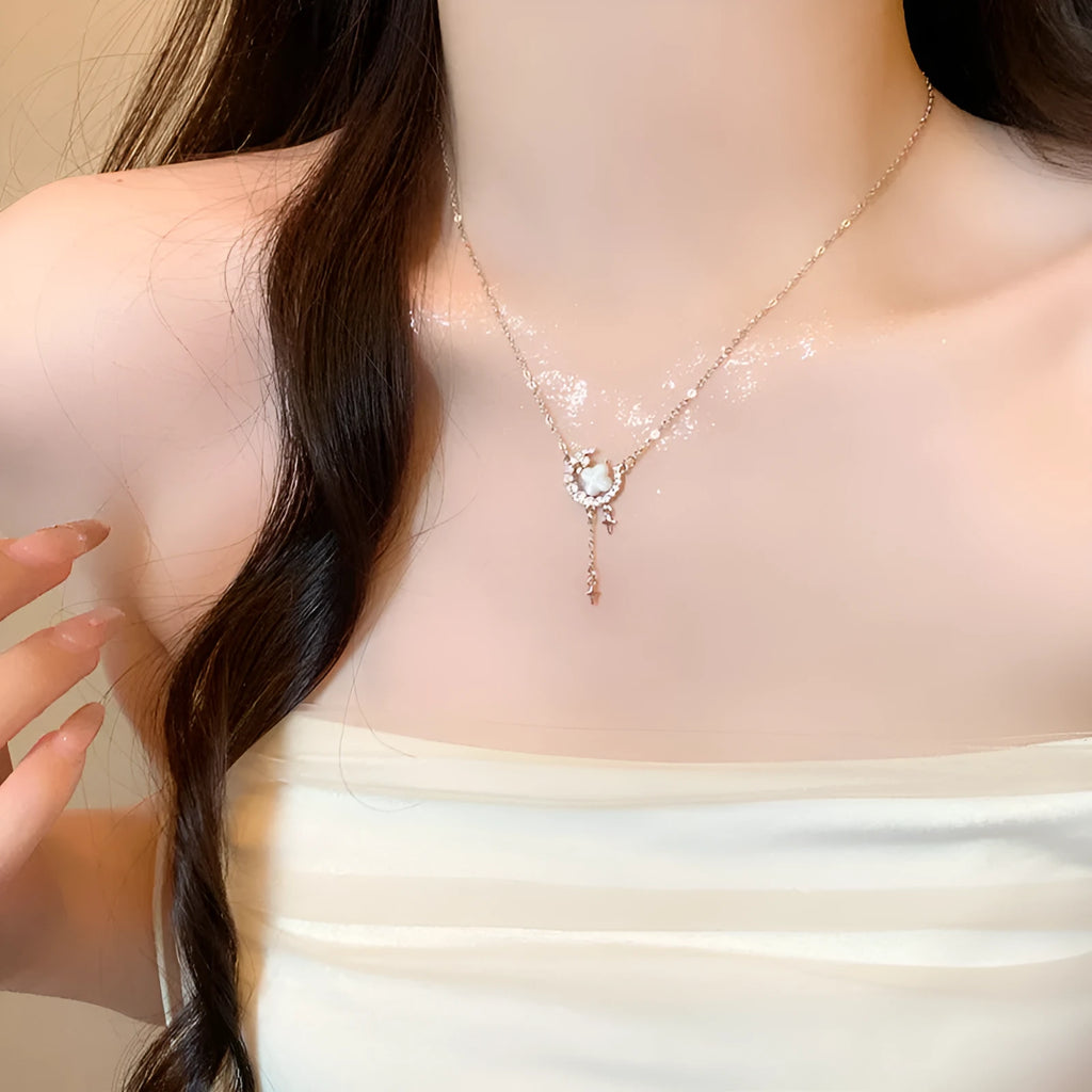 Gold star moon zirconium necklace on adjustable copper chain with celestial pendant design