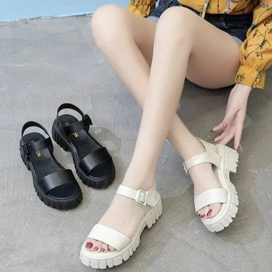Women's beige peep toe ankle strap platform sandals with buckle fastening on wooden floor