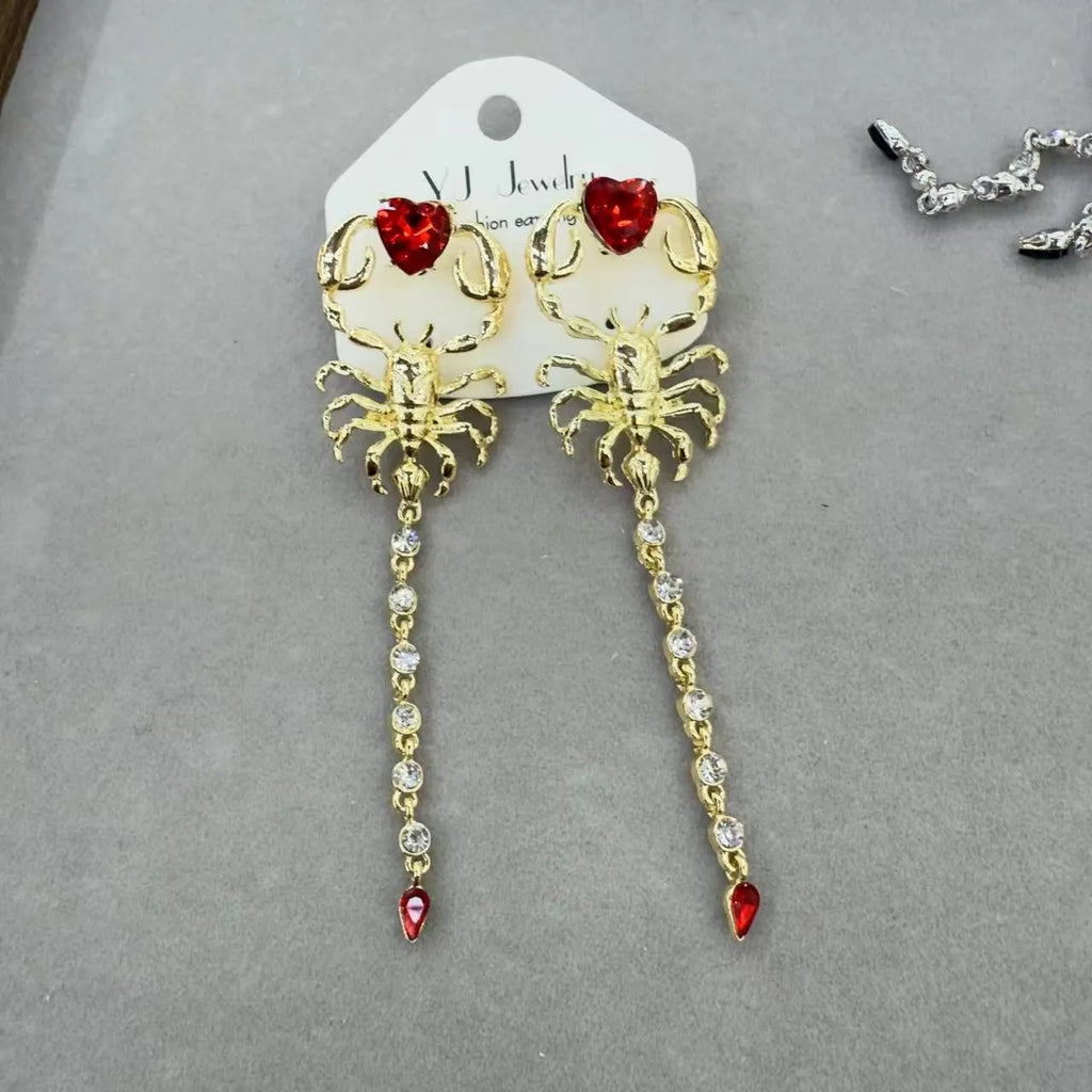 Exaggerated facial features asymmetric earrings for women in gold, alloy electroplated insect style