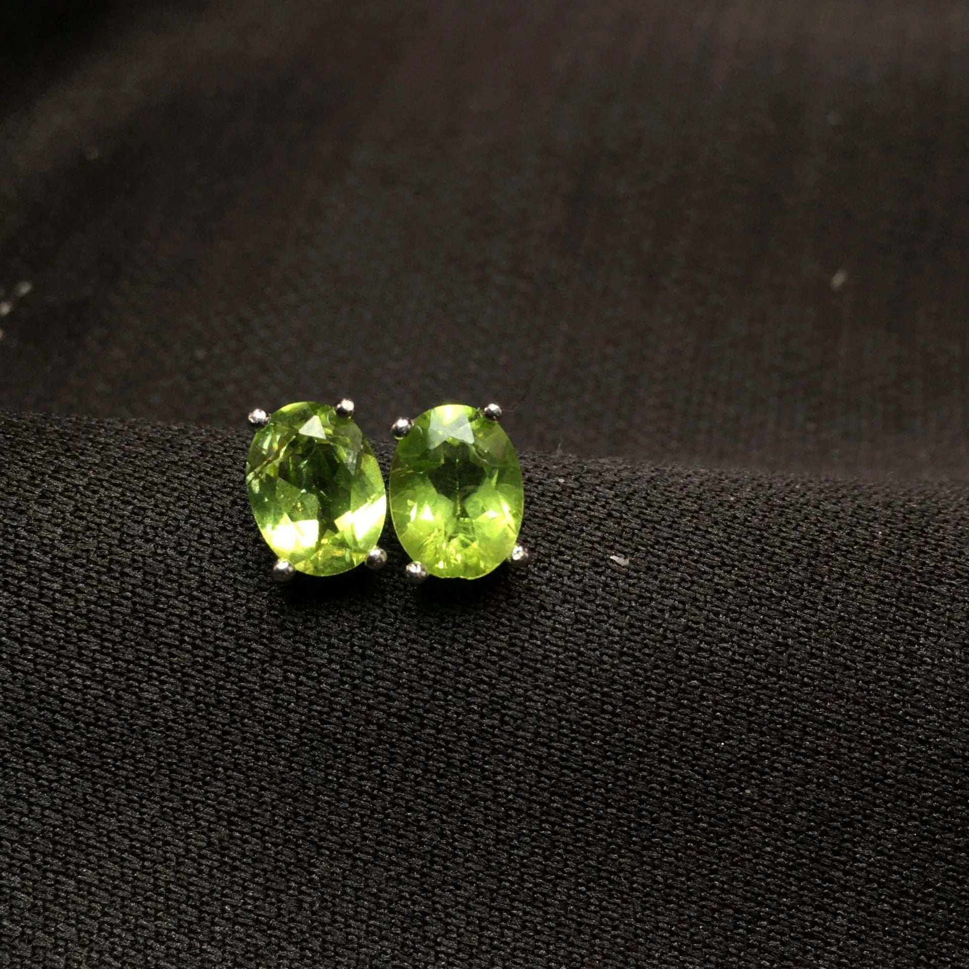 Natural grass green olivine faceted stud earrings in S925 silver, oval stone 6mm by 8mm.