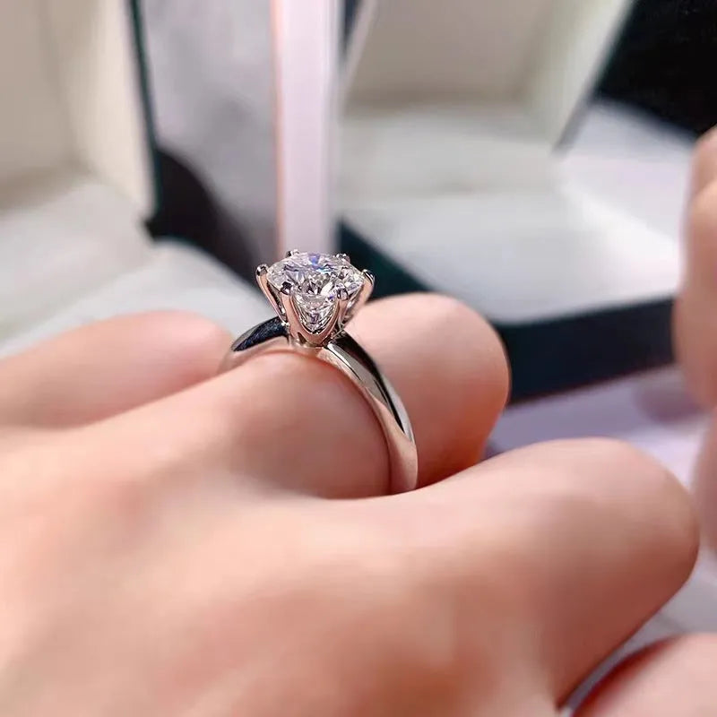White gold plated geometric ring with a six-claw setting holding a zircon stone