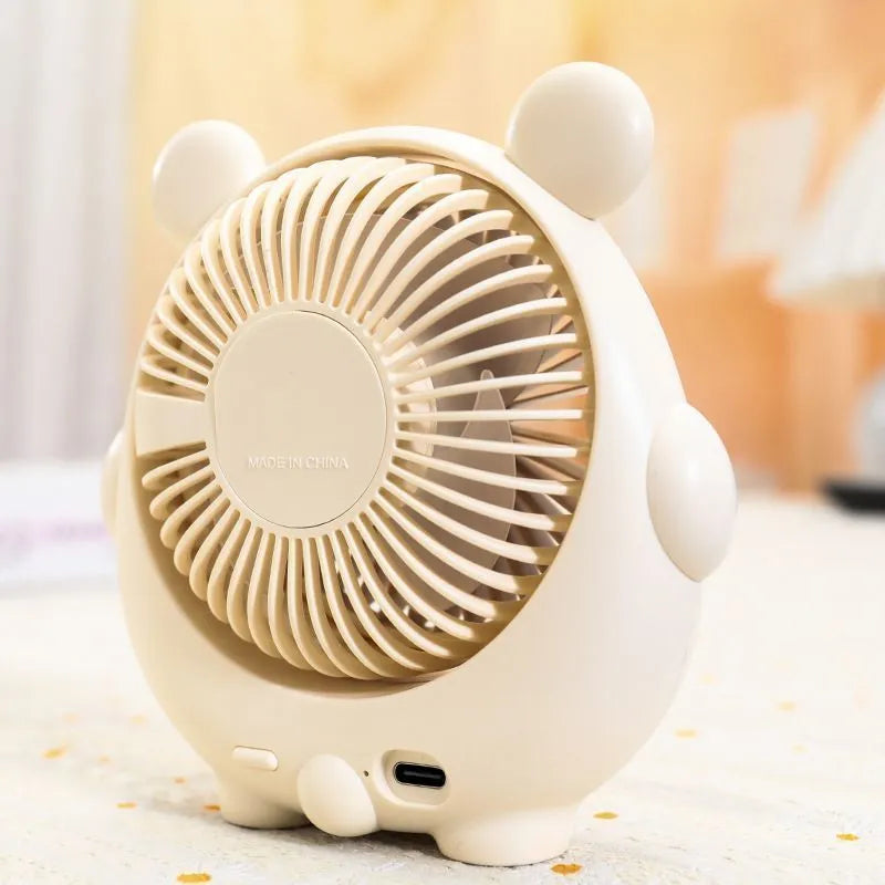 Dog-themed USB desktop electric fan in one of six colour options on a desk.