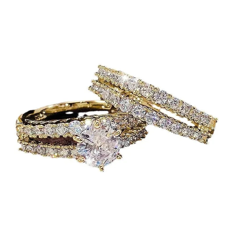 Two-ring women's set showing jewelled and geometric designs in silver, gold, and rose gold alloy