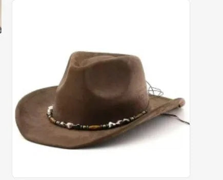 Brown leather velvet curved edge Western cowboy hat with a conical crown on a wooden surface.