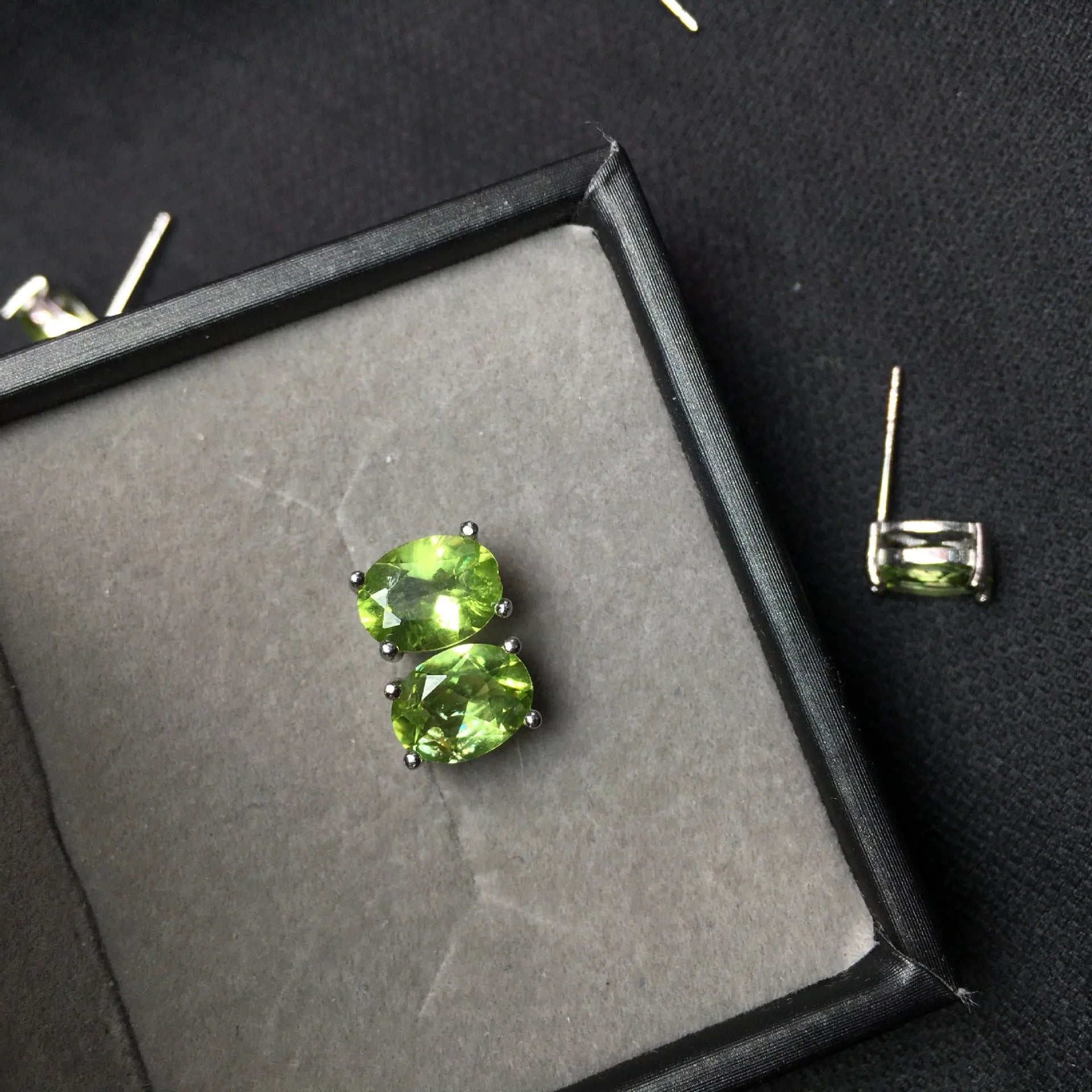 Natural grass green olivine faceted stud earrings in S925 silver, oval stone 6mm by 8mm.