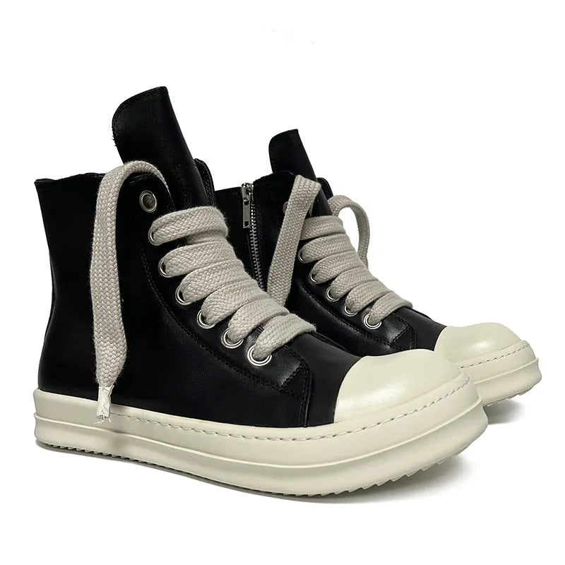 Black high-top leather shoes with a side zip and round toe on a rubber sole.