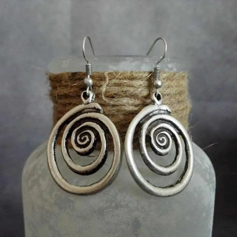 Geometric spiral earrings with distressed silver finish and national style details