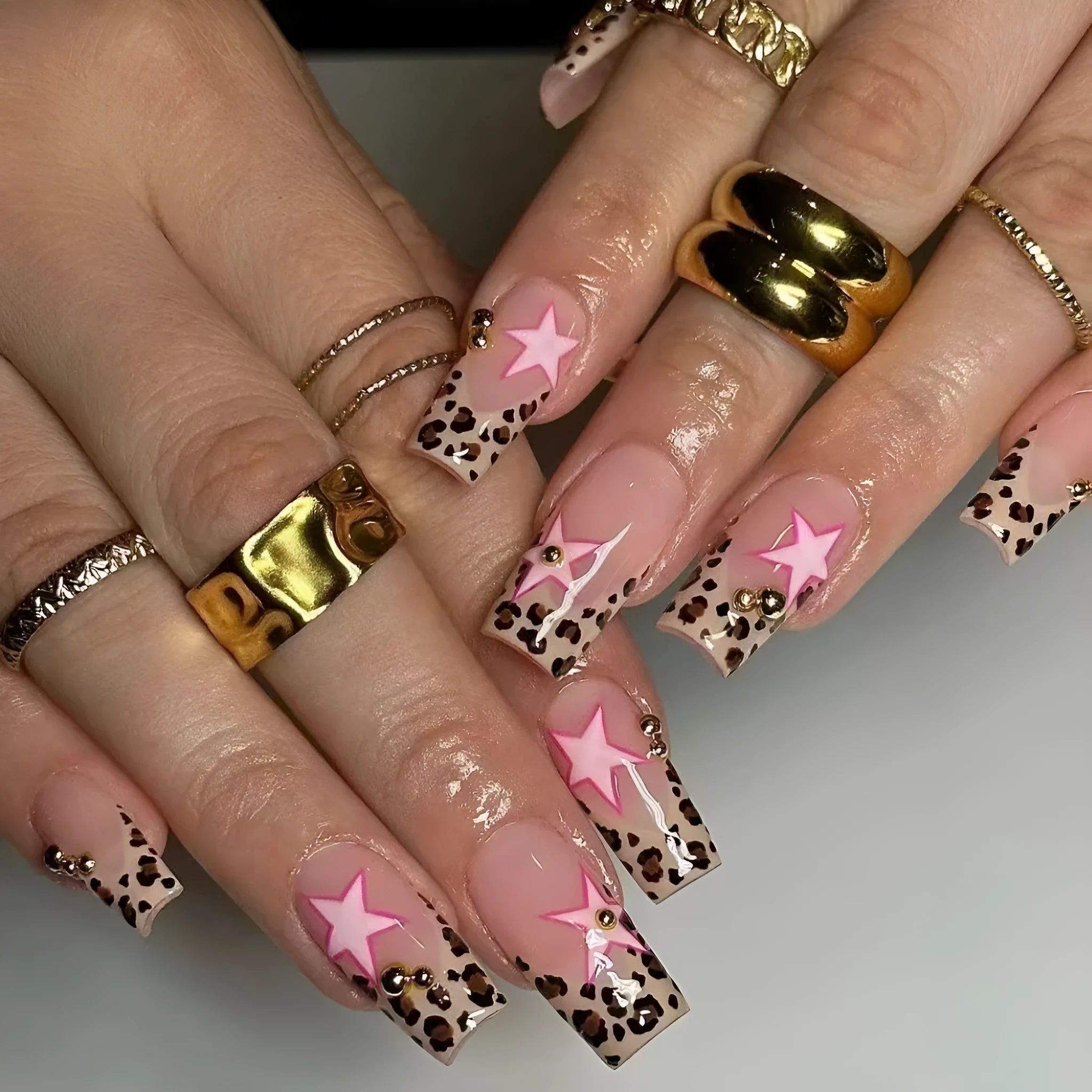 Leopard print French manicure nail art stickers with rhinestone pearls and metallic five-pointed star accessories