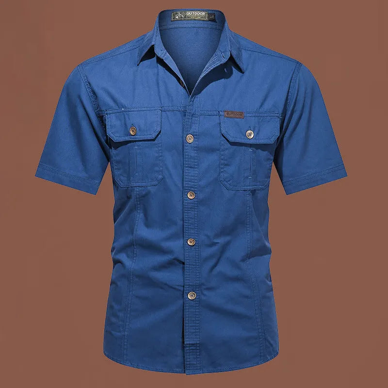 Men's army green cotton work shirt with short sleeves and non-iron finish on a hanger.
