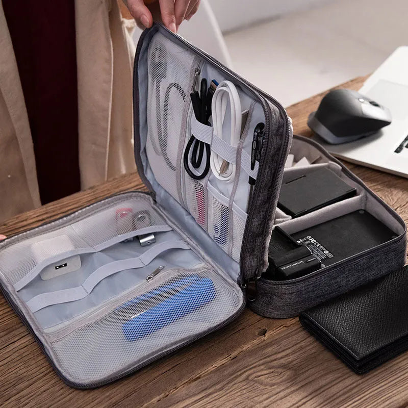 Grey waterproof double-layer travel cable organizer bag with portable handle and multiple pockets