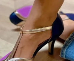Women's round toe high heel shoe in artificial PU leather with button fastening.
