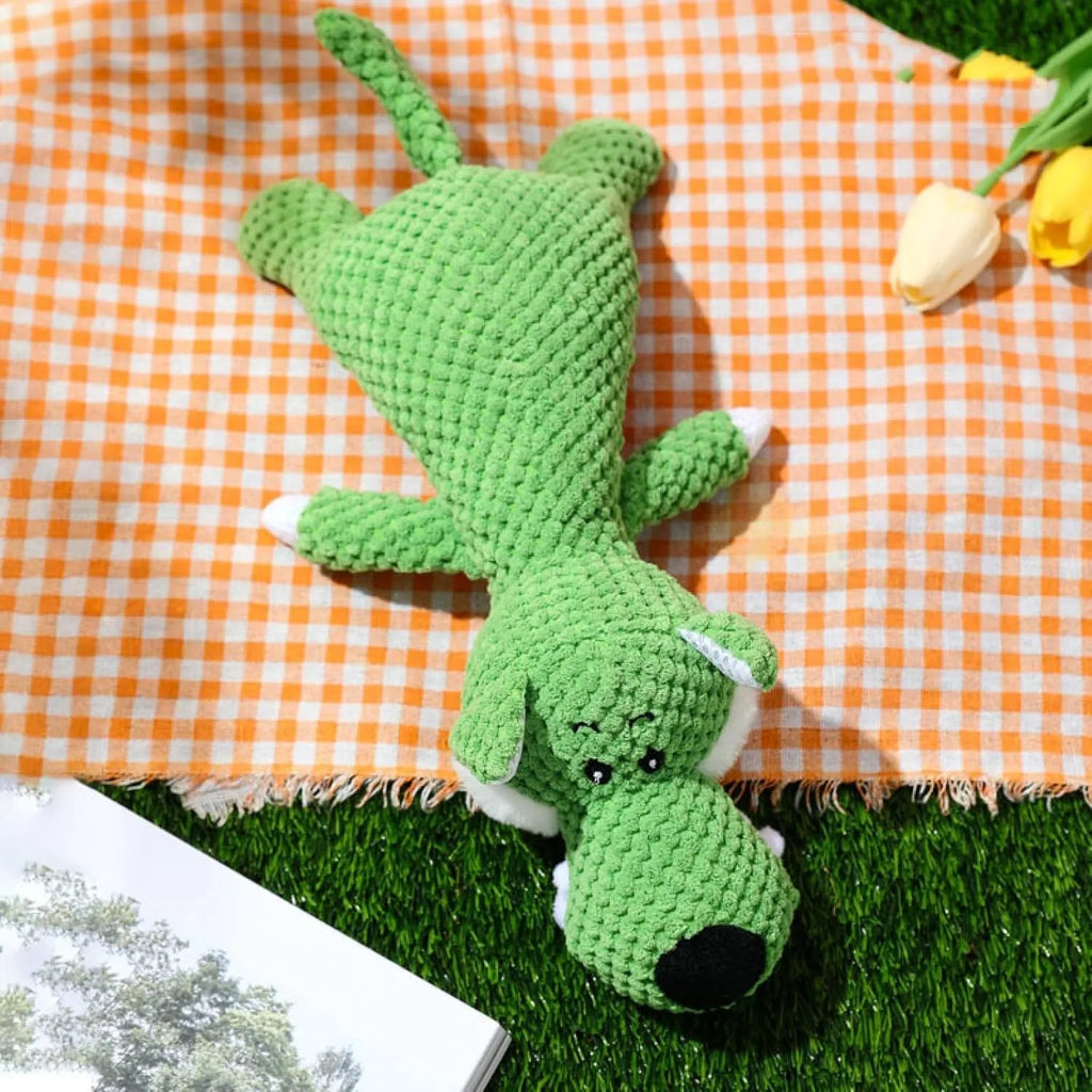 Pet dog plush chewing toy with corn kernel texture and squeaker sound in animal shape