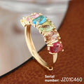 Gold-coloured adjustable zircon ring with simple retro design on a white background