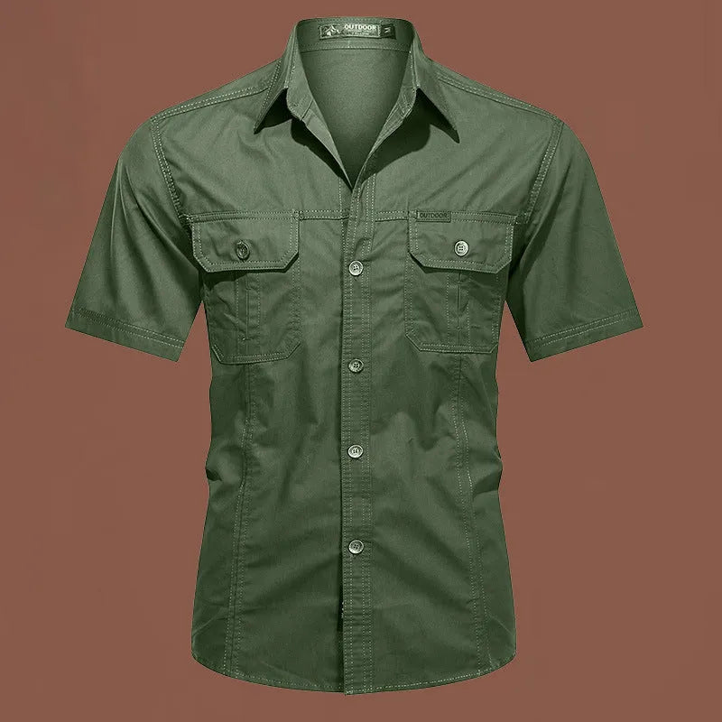 Men's army green cotton work shirt with short sleeves and non-iron finish on a hanger.