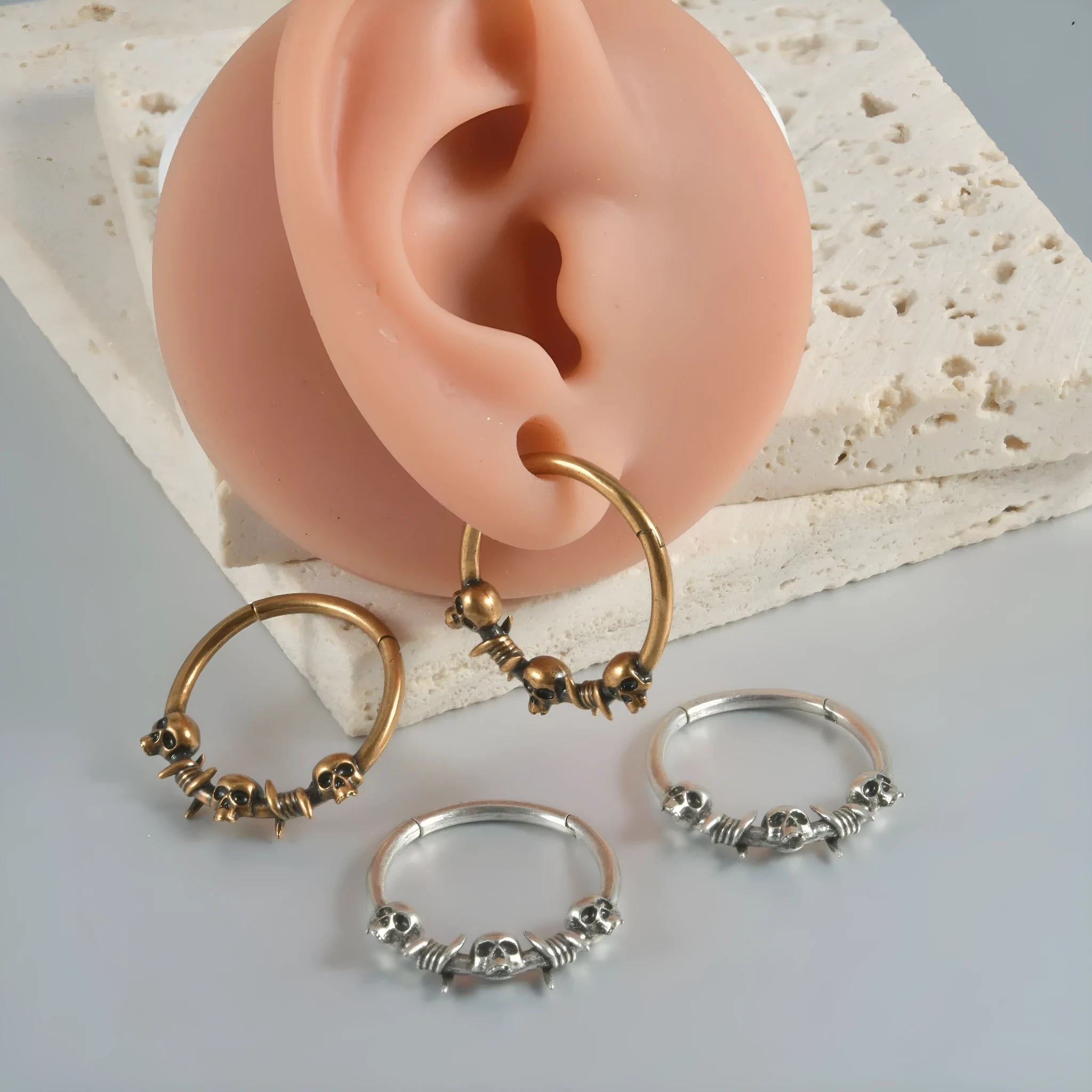 Copper punk earrings with ghost head designs in antique gold or silver finishes