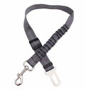 Black adjustable dog seat belt with reflective safety rope attached to car seat belt buckle, polyester webbing and alloy joint visible