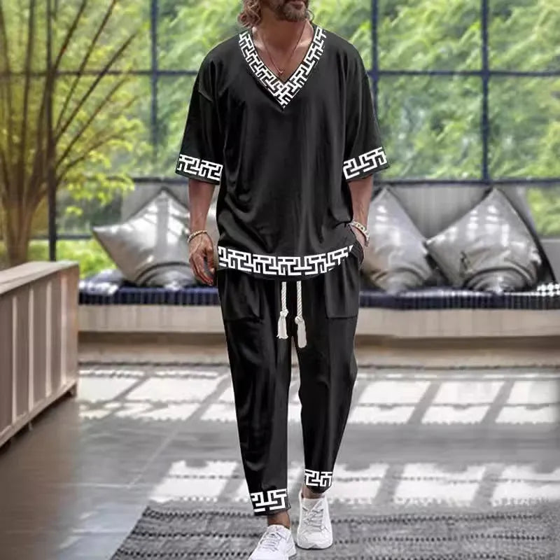 Light grey V-neck cropped sleeve trousers suit on a hanger, showing the two-piece set.