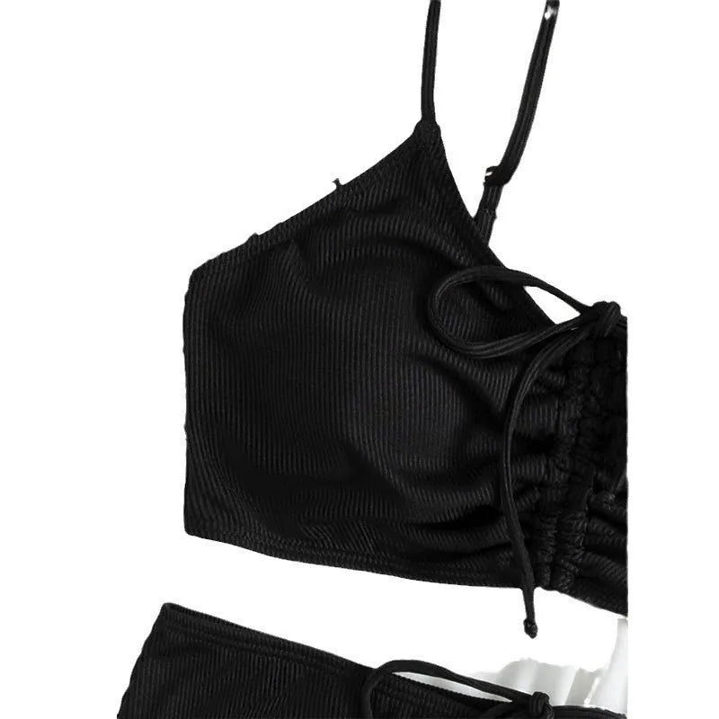 Black women's bikini swimsuit with high waist shorts and a sleeveless top on a mannequin.