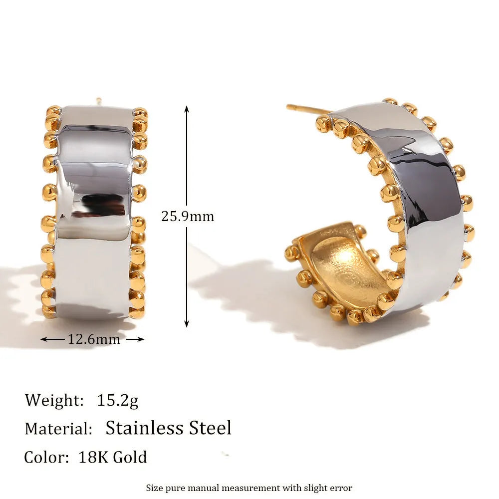 Gold tone electroplated stainless steel jewellery set with geometric shapes including earrings, bracelet and necklace