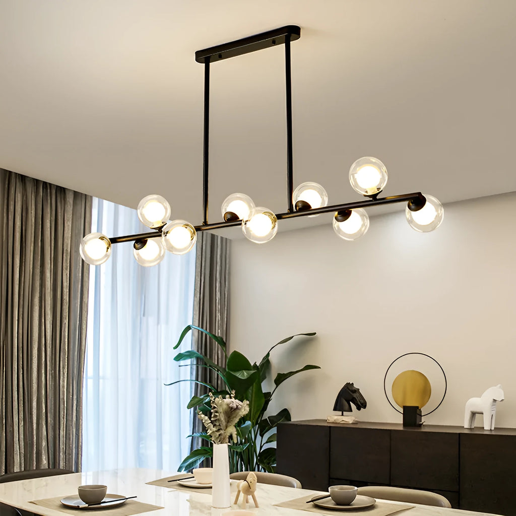 Glass bubble ball chandelier with black iron frame, clear glass shades, and multiple arms