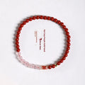 Hand-woven unisex retro Koi bracelet with Purple Gold Sand, Strawberry Quartz, and crystal beads on display