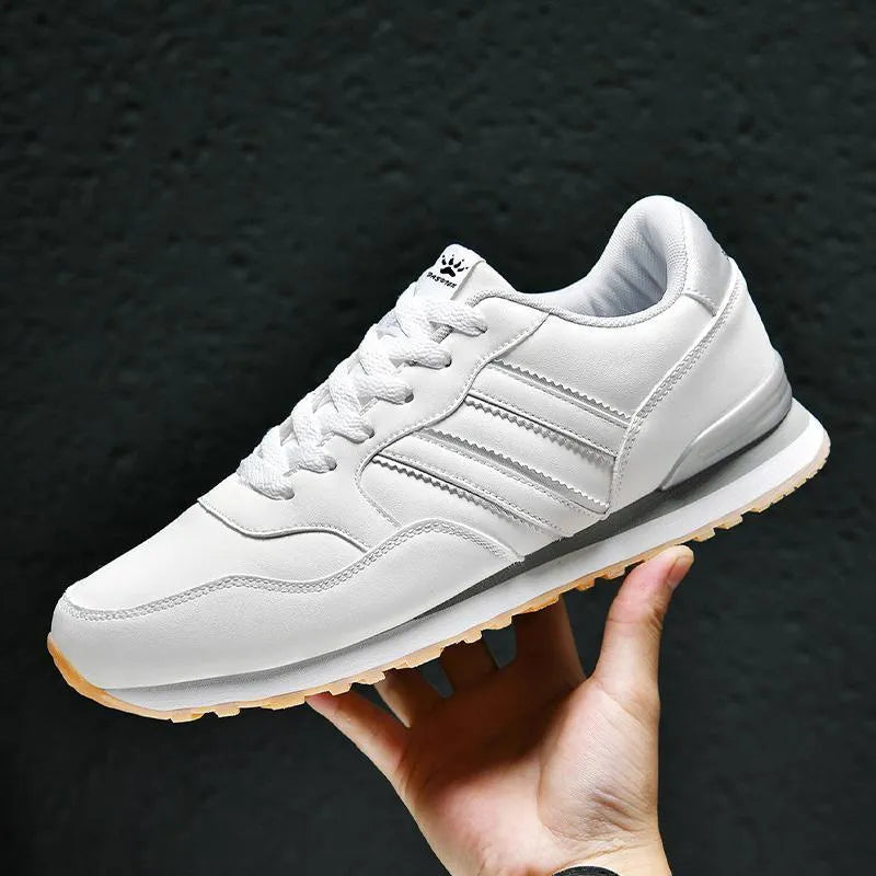 Men's casual running sports shoes with carved wing pattern in black and white space leather