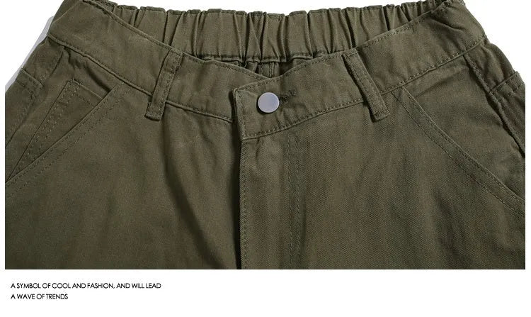 Women's apricot workwear-style cropped pants with wide legs and pocket rivets.