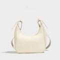 Simple all-match crescent PU crossbody bag in black with single shoulder strap and open outer pocket for women