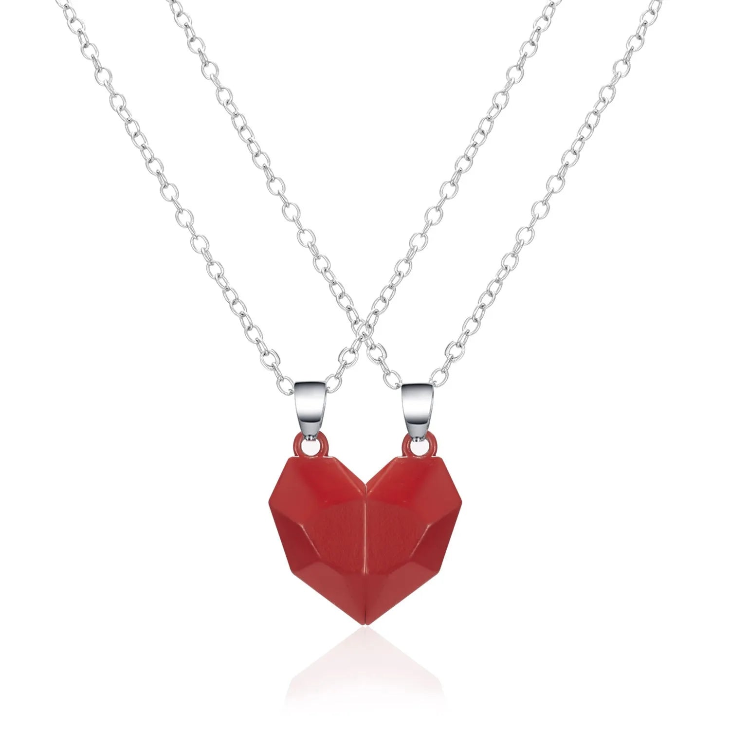 Gold-plated magnetic faceted heart pendant necklace in black and white on display