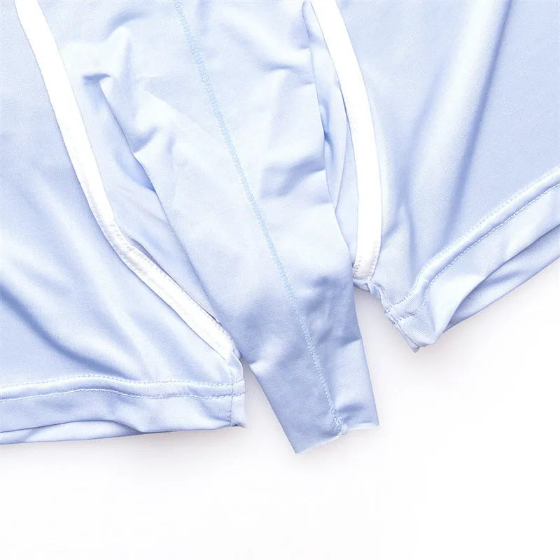 Men's solid colour ice silk boxer briefs on a mid waist model, showing the gray, black, blue, and green colour options.
