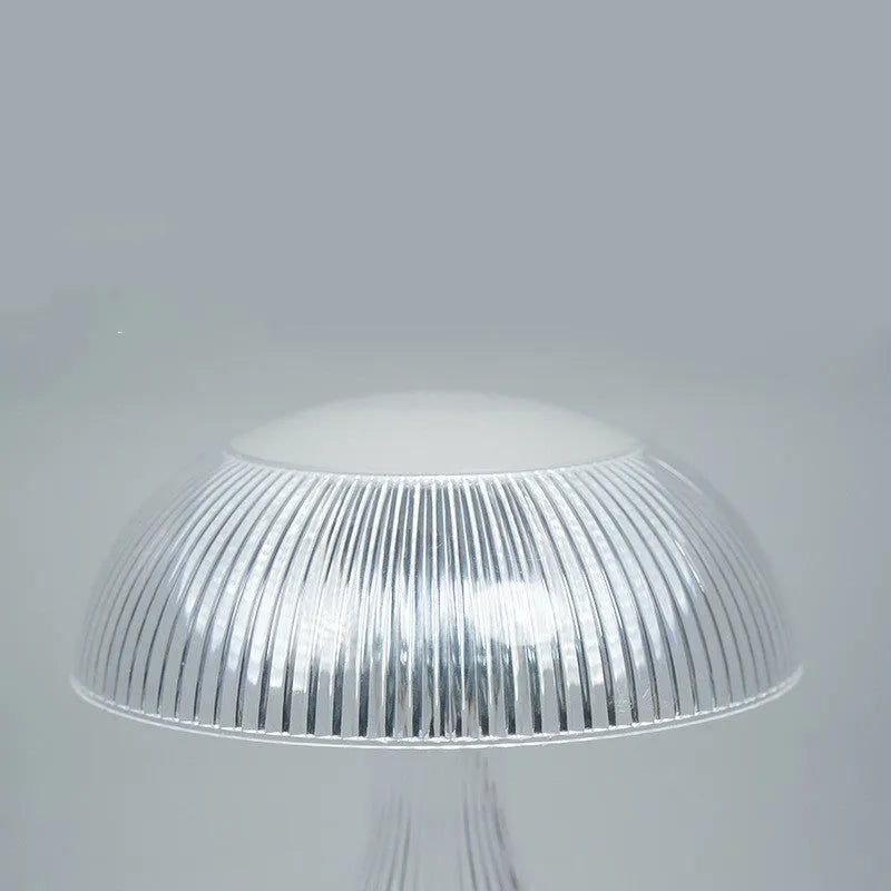 Small white night lamp with USB charging cable and touch control on wooden table