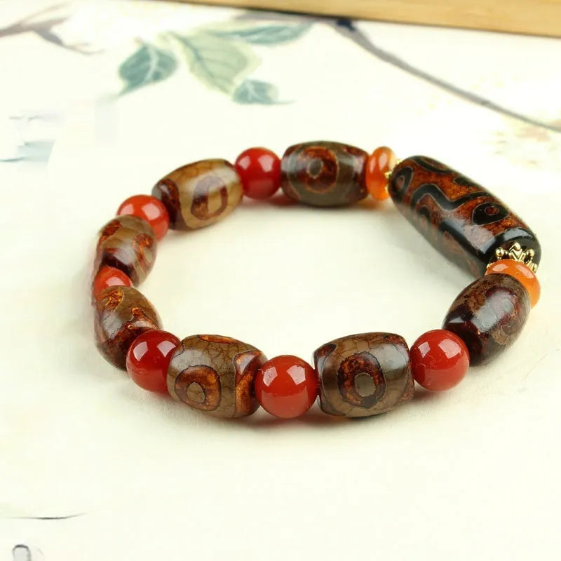 Distressed agate Tibet beads bracelet with three eye dzi design and polished stone beads