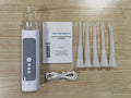 Milky white tonsil stone removal tool oral cleaning kit on a plain background.