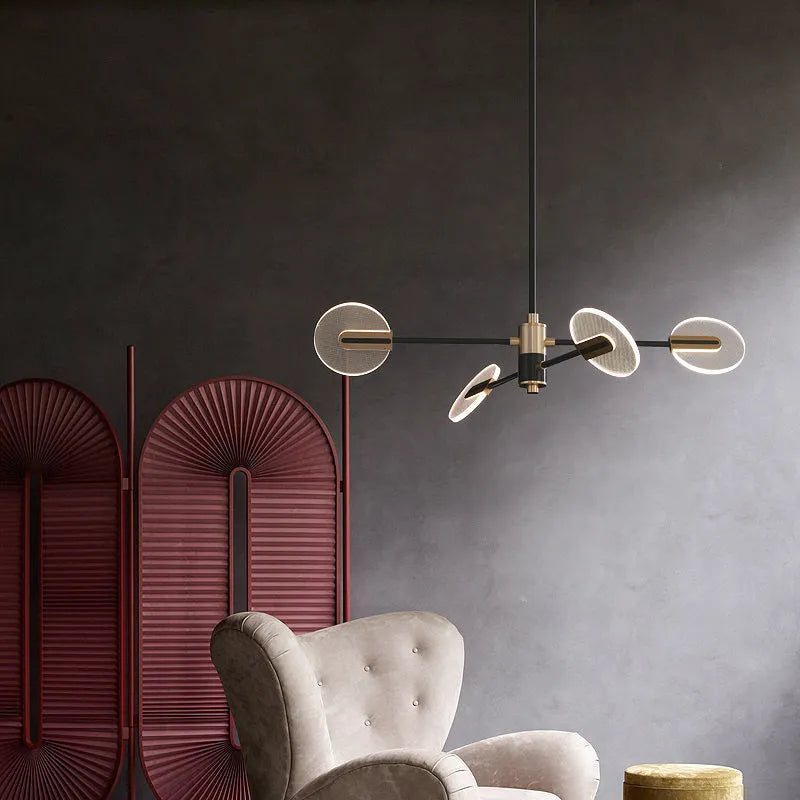 Nordic style LED chandelier with black iron frame and white acrylic shades, shown in a dining room setting.