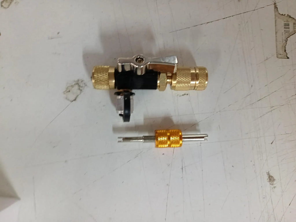 Metal vacuum valve core disassembly tool set showing 1/4-inch black and 5/16-inch pink valve removers