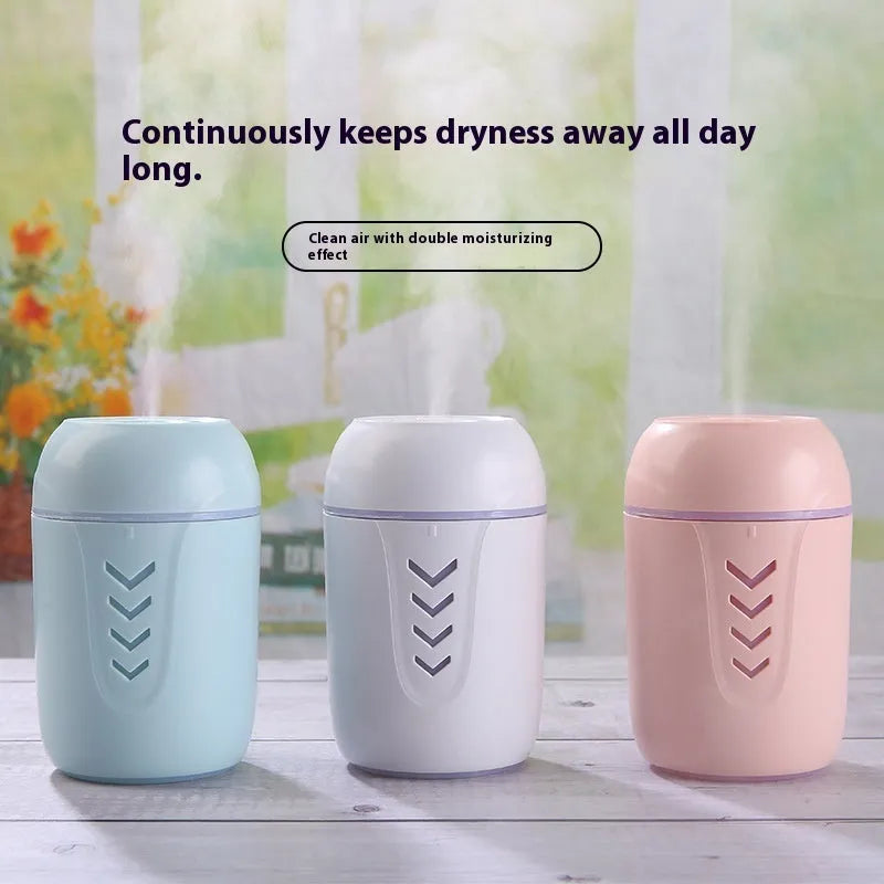Round white portable USB air purifier for car and desktop use on a wooden surface.