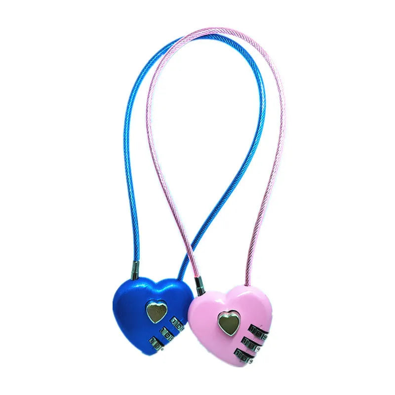 Peach heart shaped wire rope lock in multiple colours with a long steel cable, shown next to a bicycle helmet.