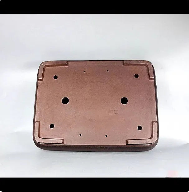 Handmade rectangular purple clay flower pot on a tabletop