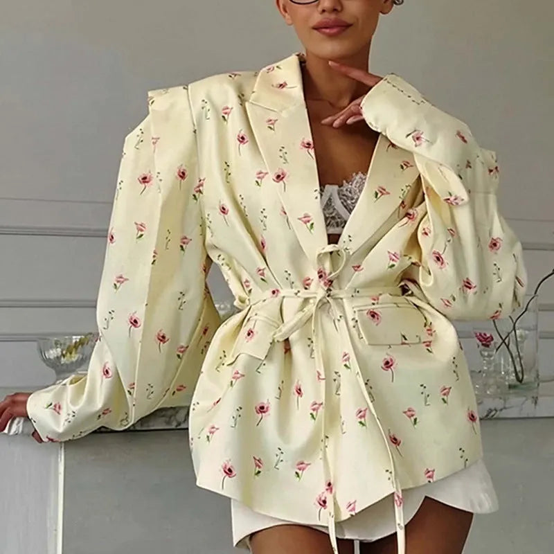 Women's white polyester suit jacket with a lace-up detail cinching the waist.