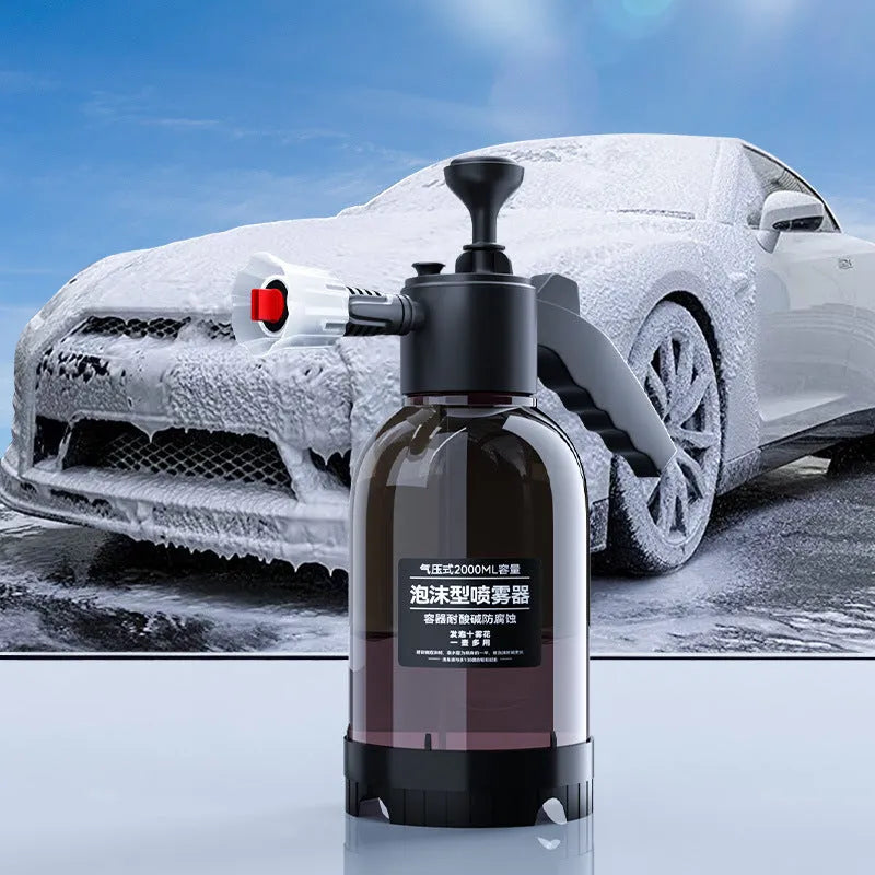 Black hand-held 2 litre foam sprayer with lock switch and nozzle attachments