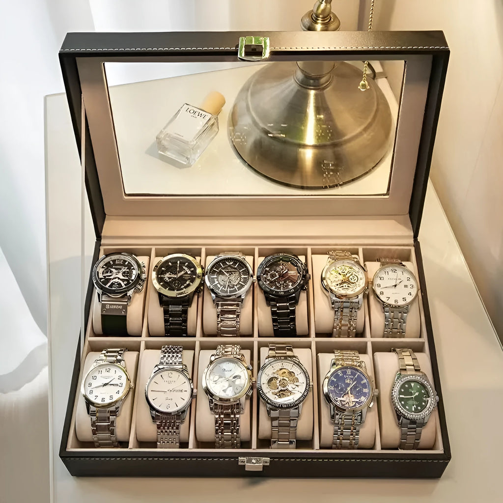 Grey leather watch storage box with clear dustproof lid showing multiple watch slots inside.